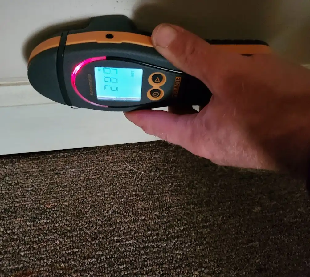Moisture detection at baseboard during Storm Damage Restoration in Waycross